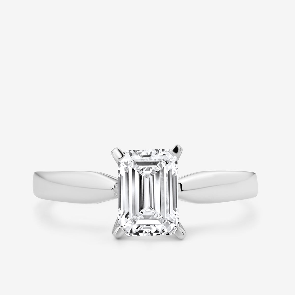 The Keemti Jewels MINIMAL Emerald Solitaire RING features a rectangular emerald-cut stone in white gold.