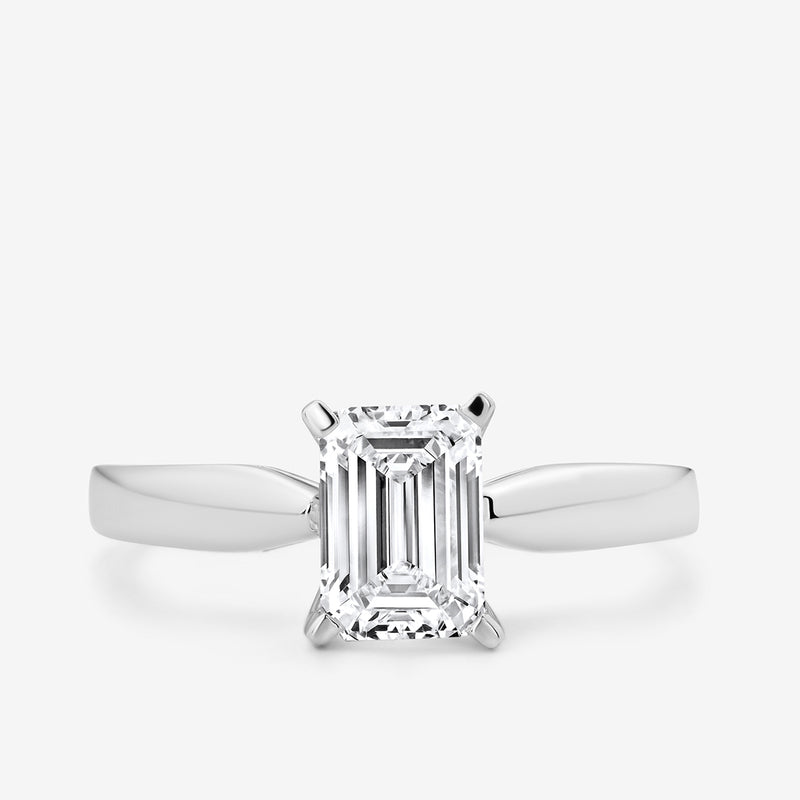 The Keemti Jewels MINIMAL Emerald Solitaire RING features a rectangular emerald-cut stone in white gold.