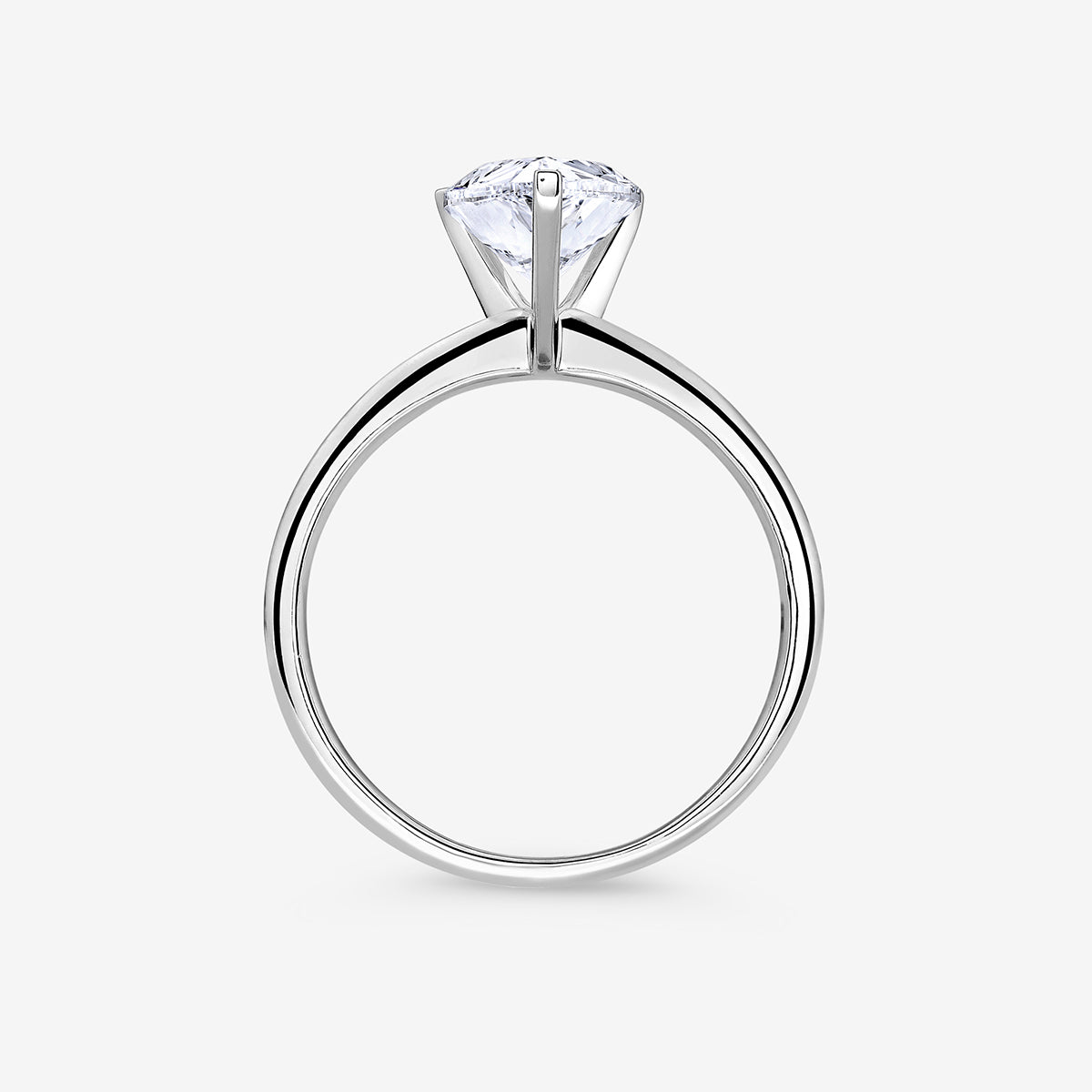 The Keemti Jewels EVERDEW Pear Solitaire Ring showcases a stunning pear diamond in a classic prong setting, side view.