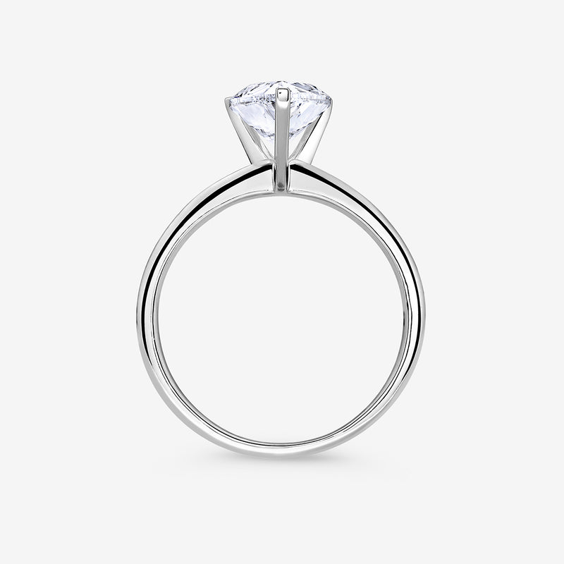 The Keemti Jewels EVERDEW Pear Solitaire Ring showcases a stunning pear diamond in a classic prong setting, side view.