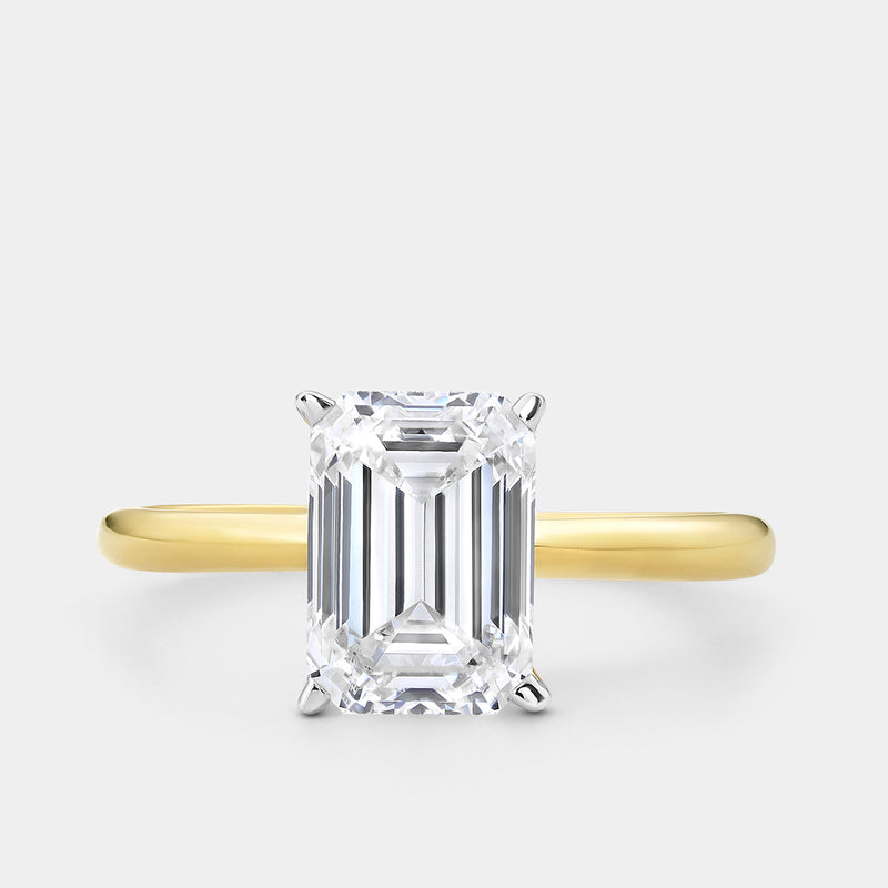 Keemti Jewels GRACE Emerald Solitaire RING: Gold band with large emerald-cut diamond in four prongs.