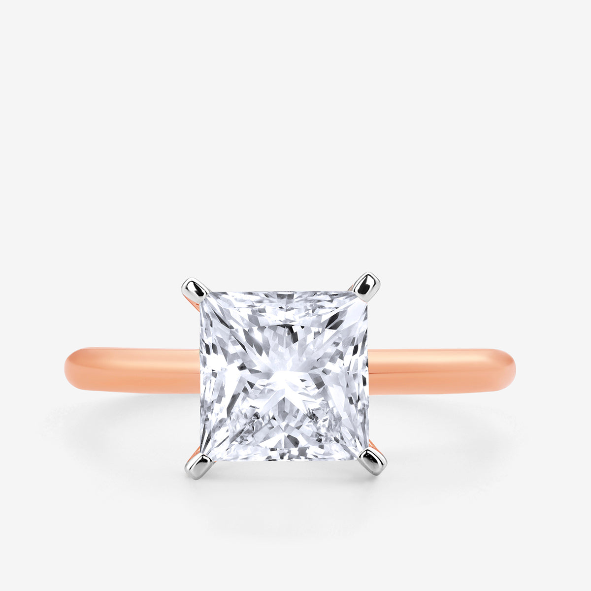 The CLASSIC Princess Engagement RING by Keemti Jewels features a princess-cut stone in rose gold on a four-prong setting.
