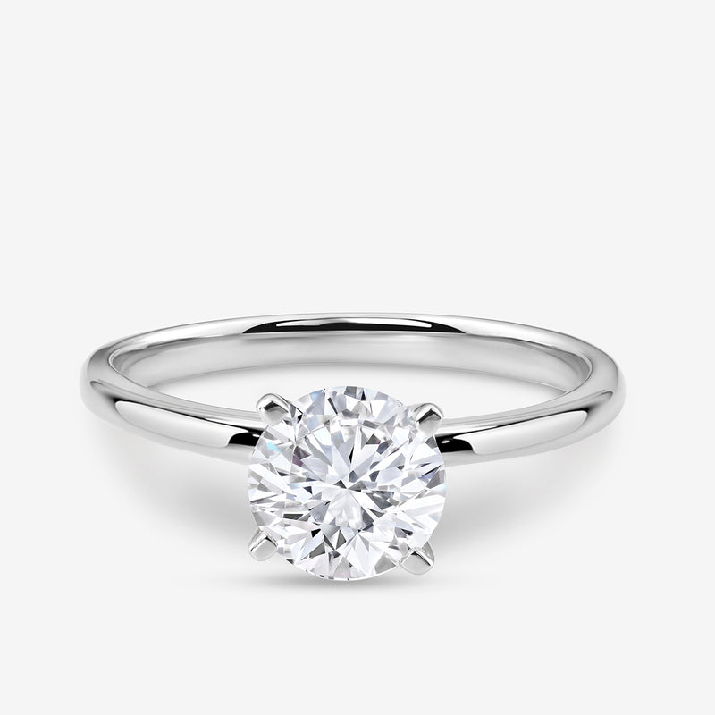 The ELEGANT Round Solitaire RING by Keemti Jewels features a round diamond in a classic silver six-prong setting.