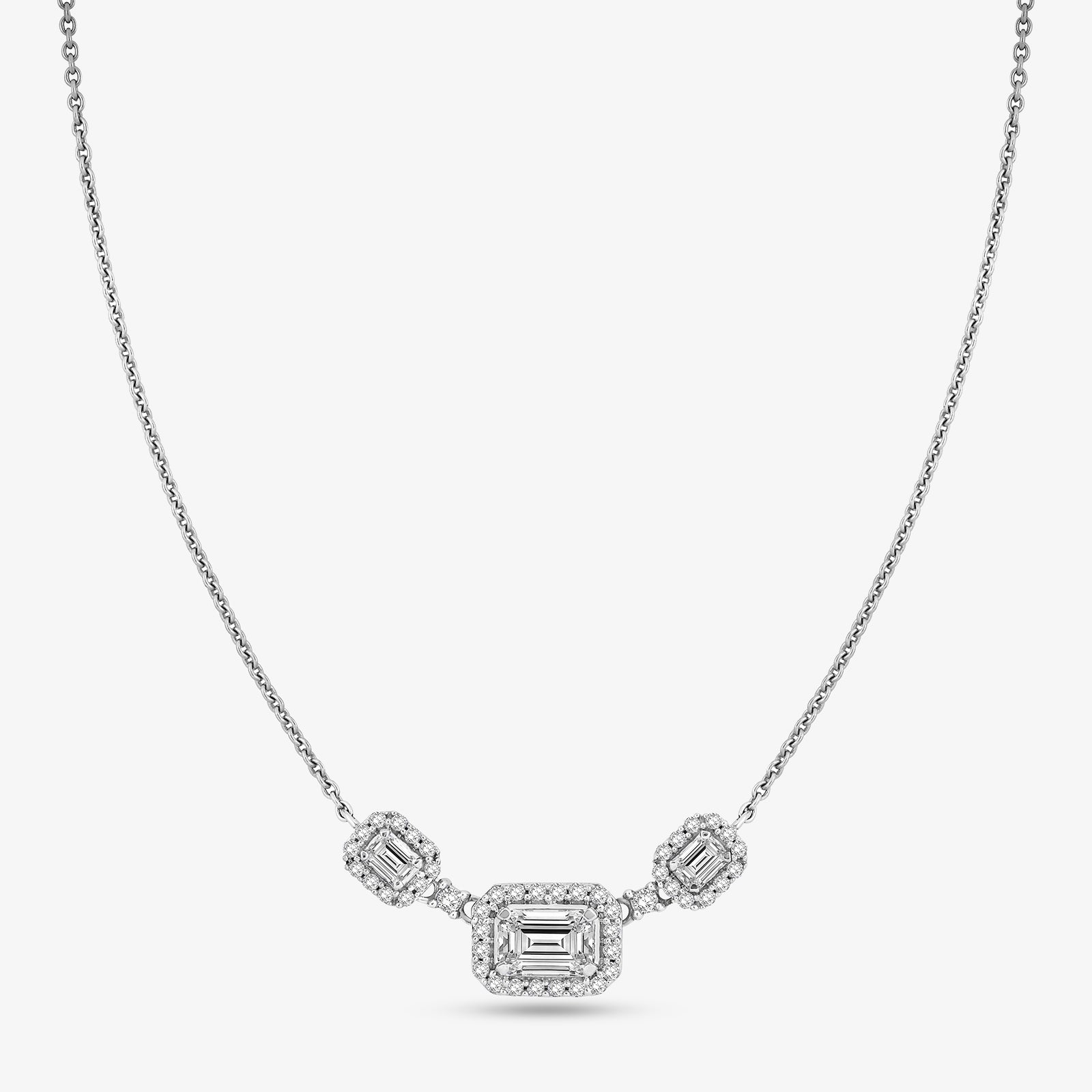 Silver-tone geometric necklace with three emerald-cut stones: center and two side squares