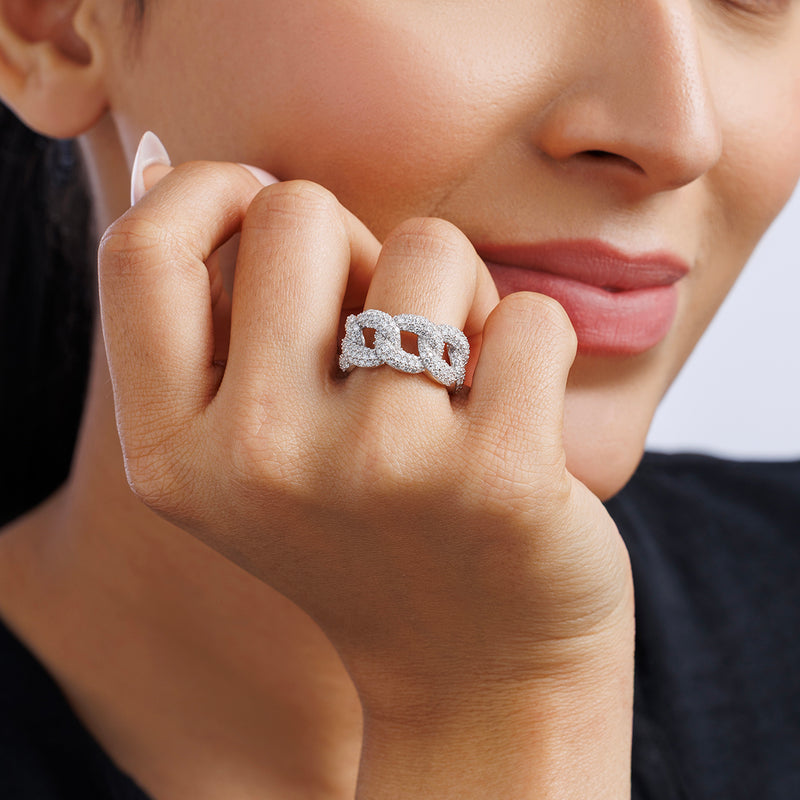 Woman wearing Keemti Jewels' STATEMENT Link Eternity RING, with light pink lipstick, hand resting on her chin.