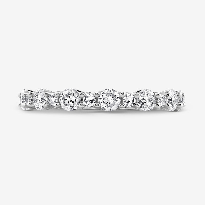 The GEOMETRIC Eternity RING by Keemti Jewels is a white gold band with round diamonds in shared prong settings.