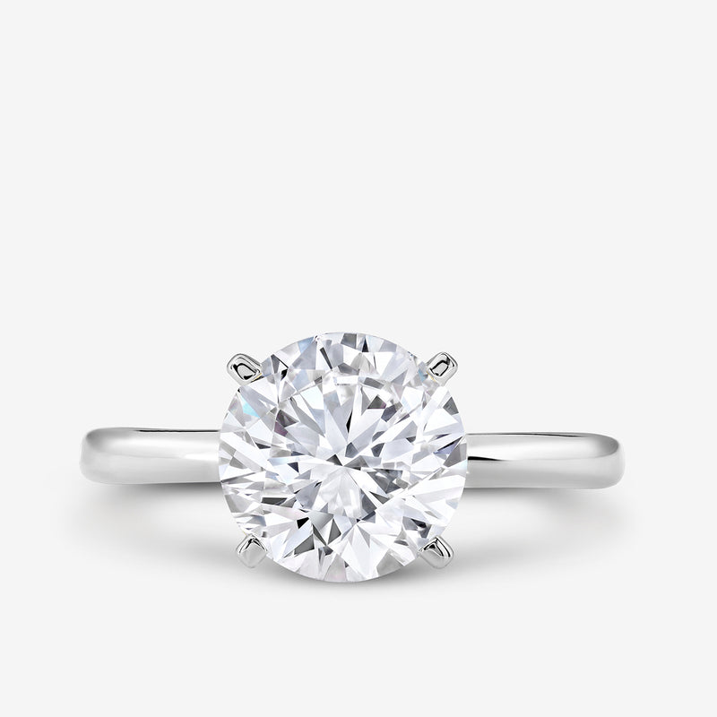 The ELEGANT Round Solitaire RING by Keemti Jewels features a round stone in a six-prong setting on a silver band.