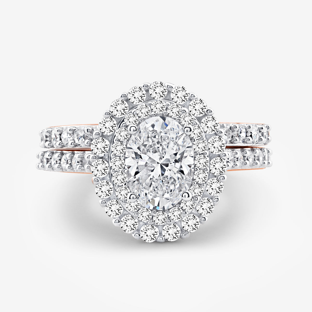 Keemti Jewels' ETERNAL Glow Oval Halo ring with pavé band, paired with a sparkling diamond wedding ring.
