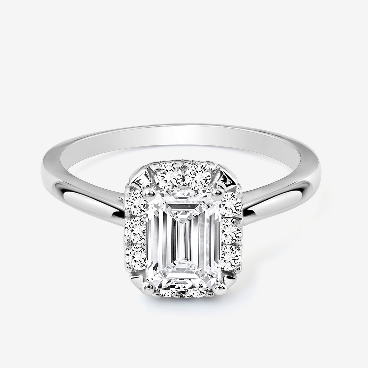 The Keemti Jewels EMERA Halo Solitaire Ring features an emerald-cut center with pavé-set and halo round diamonds.