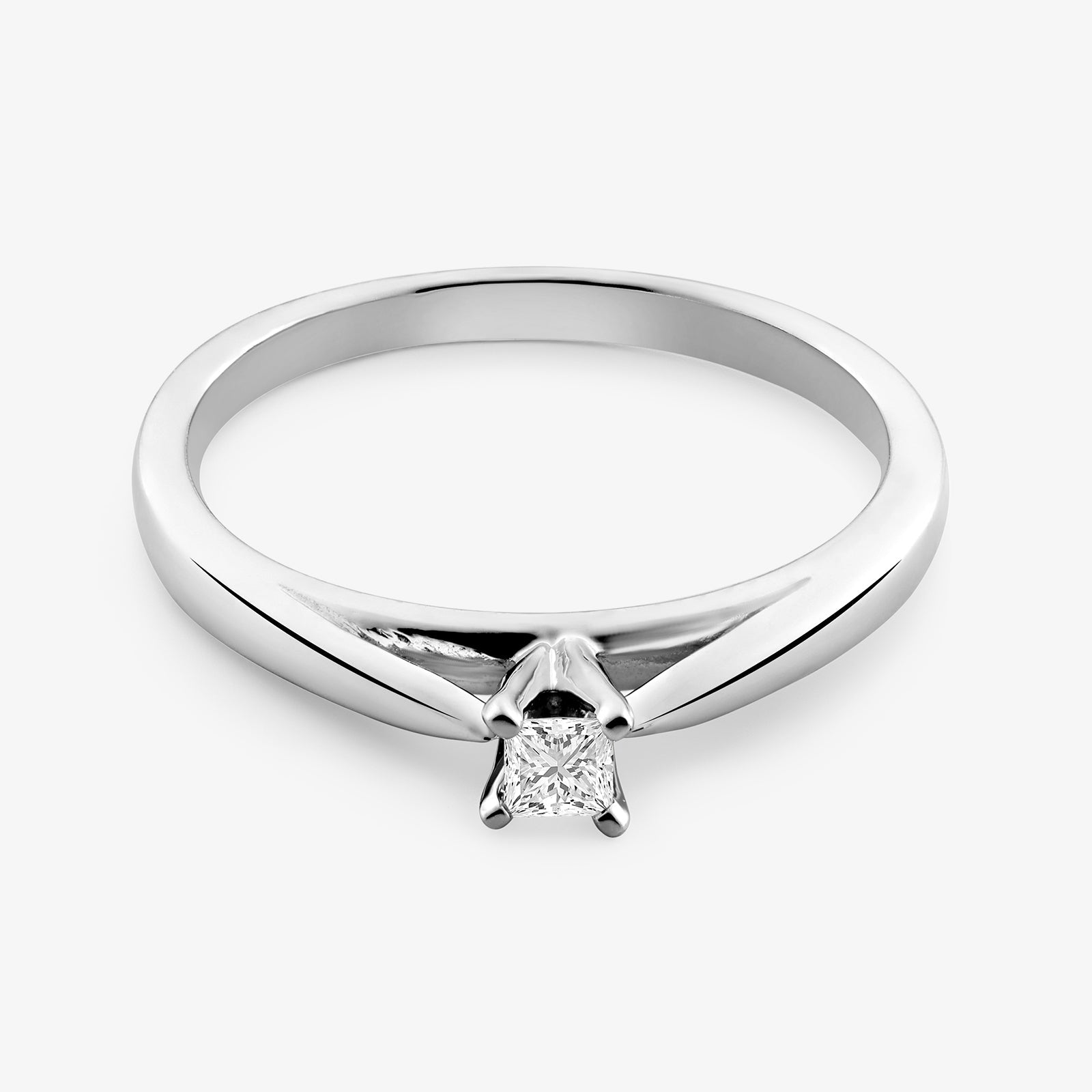 Side view: princess-cut diamond ring, central 4-prong stone, silver-tone band