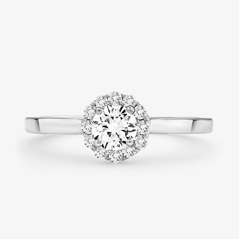Halo solitaire ring in silver vermeil with round center stone and diamond halo