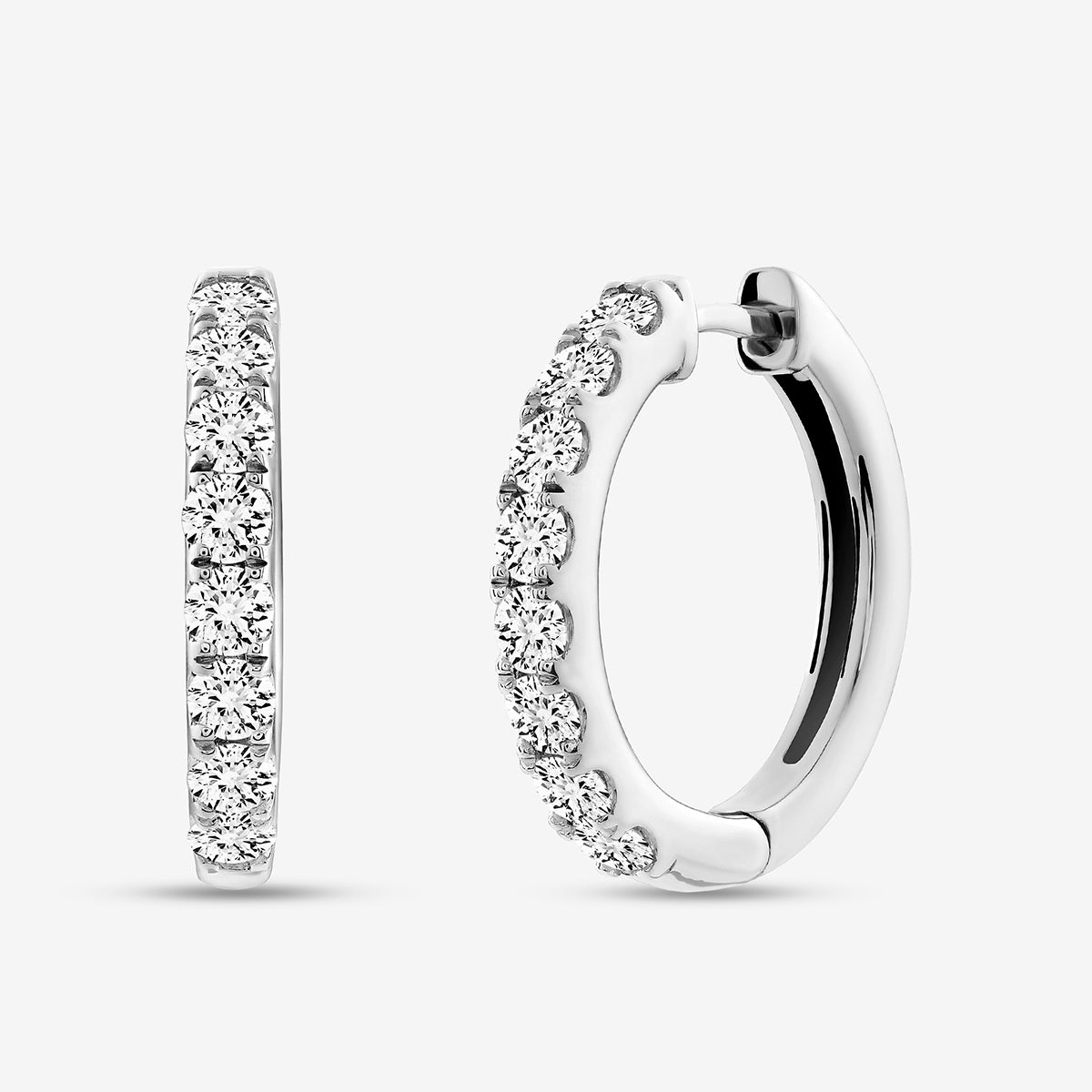 The EDGE Glow Hoop EARRINGS by Keemti Jewels feature channel-set diamonds on polished metal for extra sparkle.