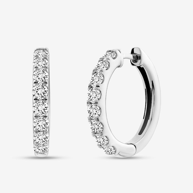 The EDGE Glow Hoop EARRINGS by Keemti Jewels feature channel-set diamonds on polished metal for extra sparkle.