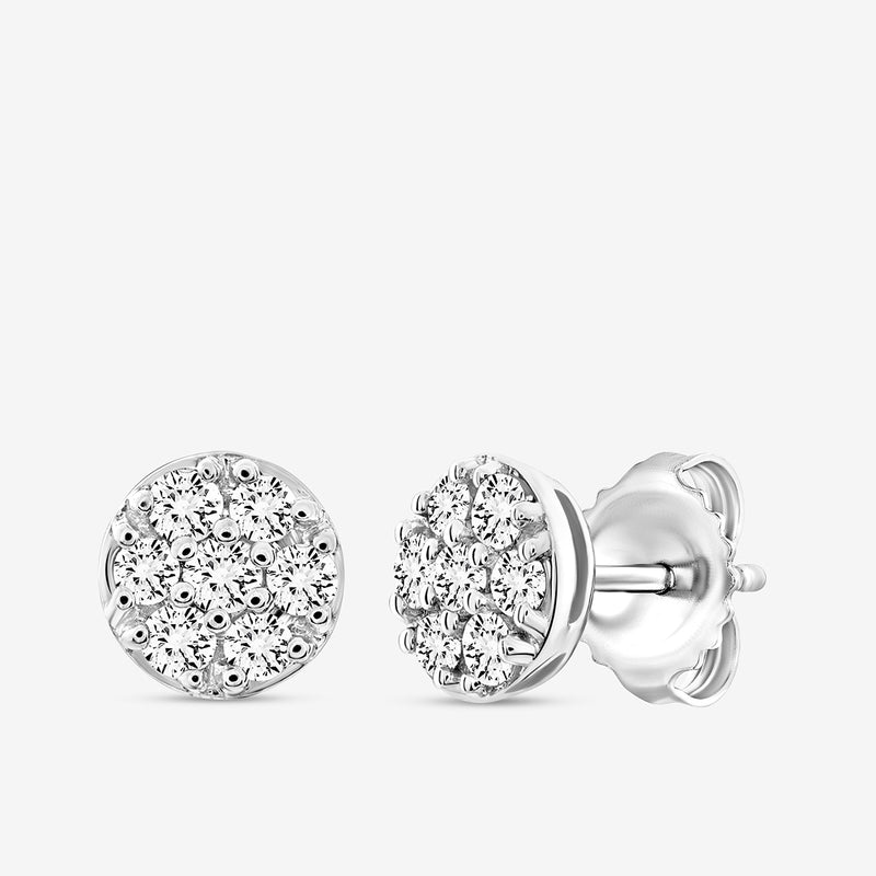 A pair of Keemti Jewels TINY Spark Stud Earrings with delicate round silver design and clustered clear gemstones.