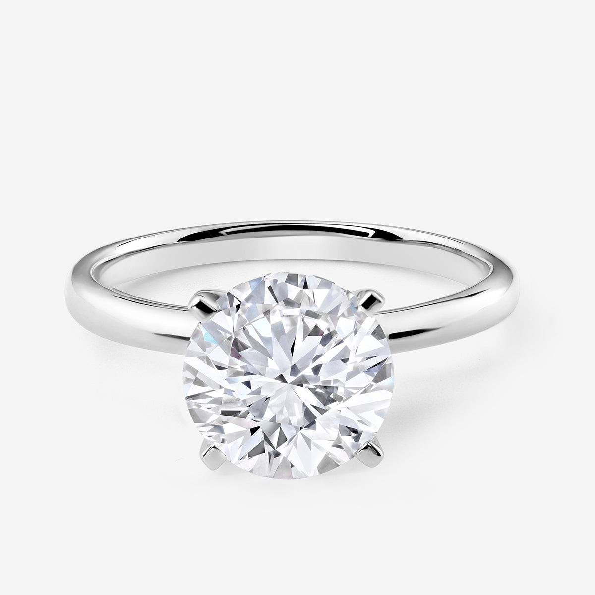 Keemti Jewels ELEGANT <span>Round Solitaire</span> RING with four-prong setting, shown on a white background.