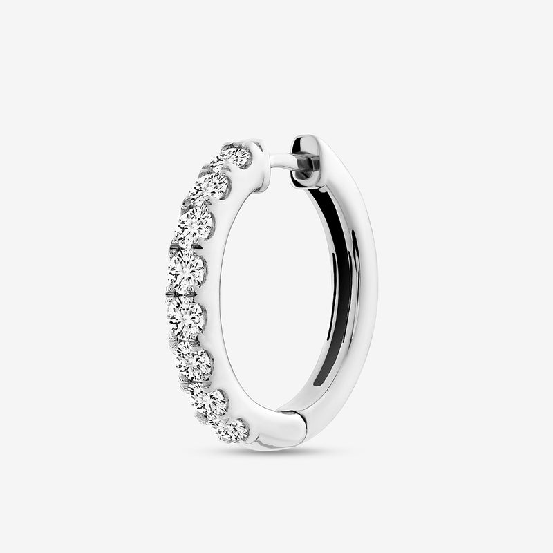 The EDGE Glow Hoop Earrings by Keemti Jewels feature channel-set diamonds on polished silver for a classic look.