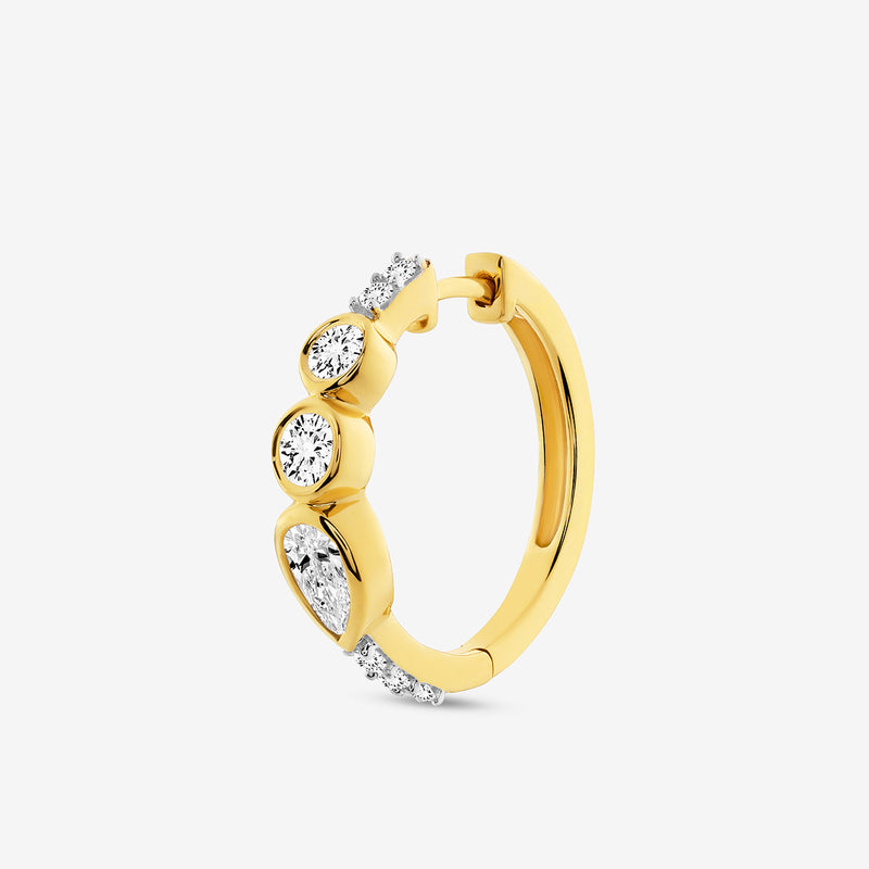 Keemti Jewels' AERIS Marquise Huggie Earrings: gold hoops with four uniquely-shaped white gemstones.