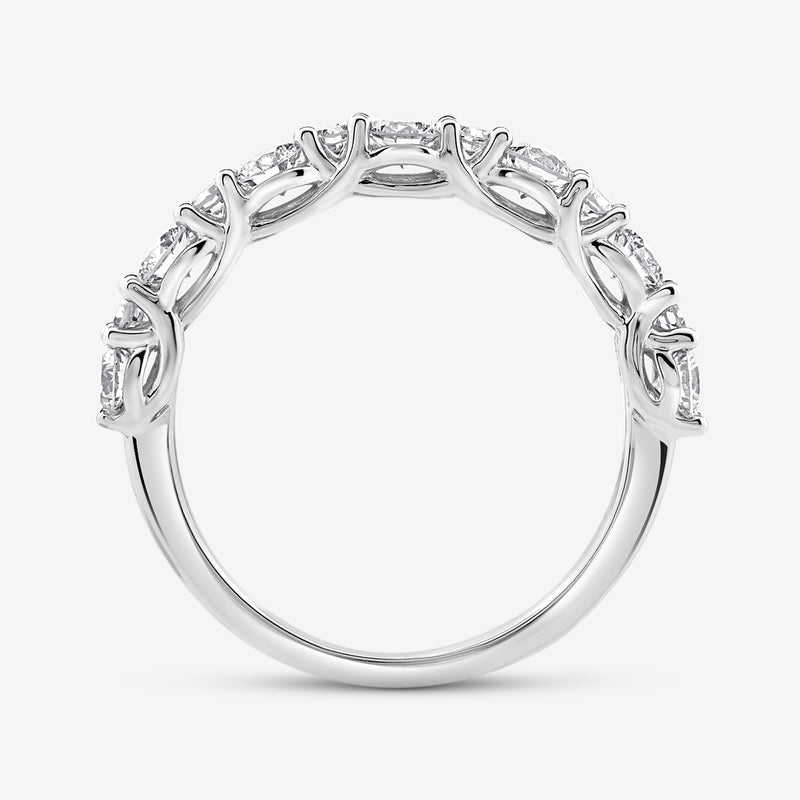 The GEOMETRIC Eternity RING by Keemti Jewels features round diamonds in a vine-like, decorative prong setting.