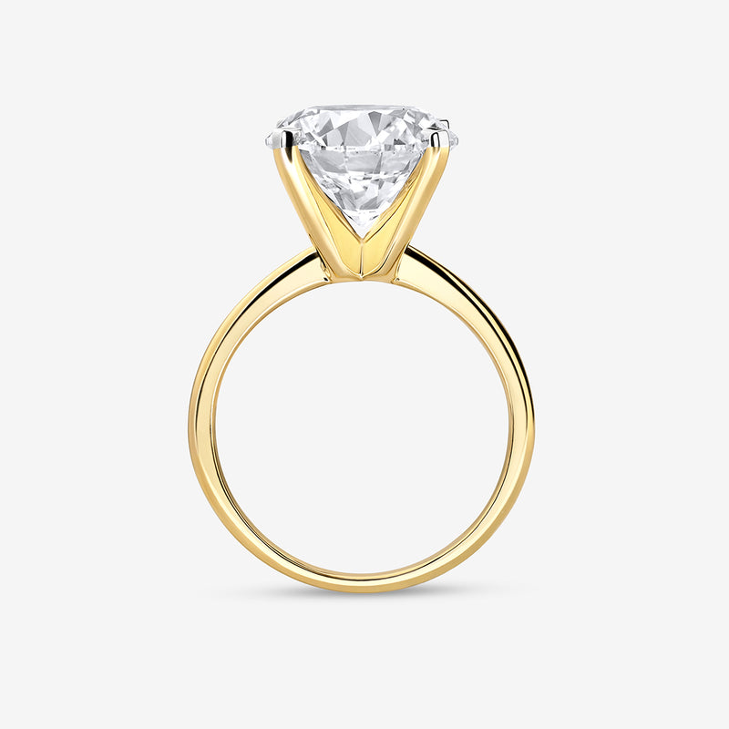 The ELEGANT Round Solitaire RING by Keemti Jewels features a gold setting and large round diamond, side view shown.
