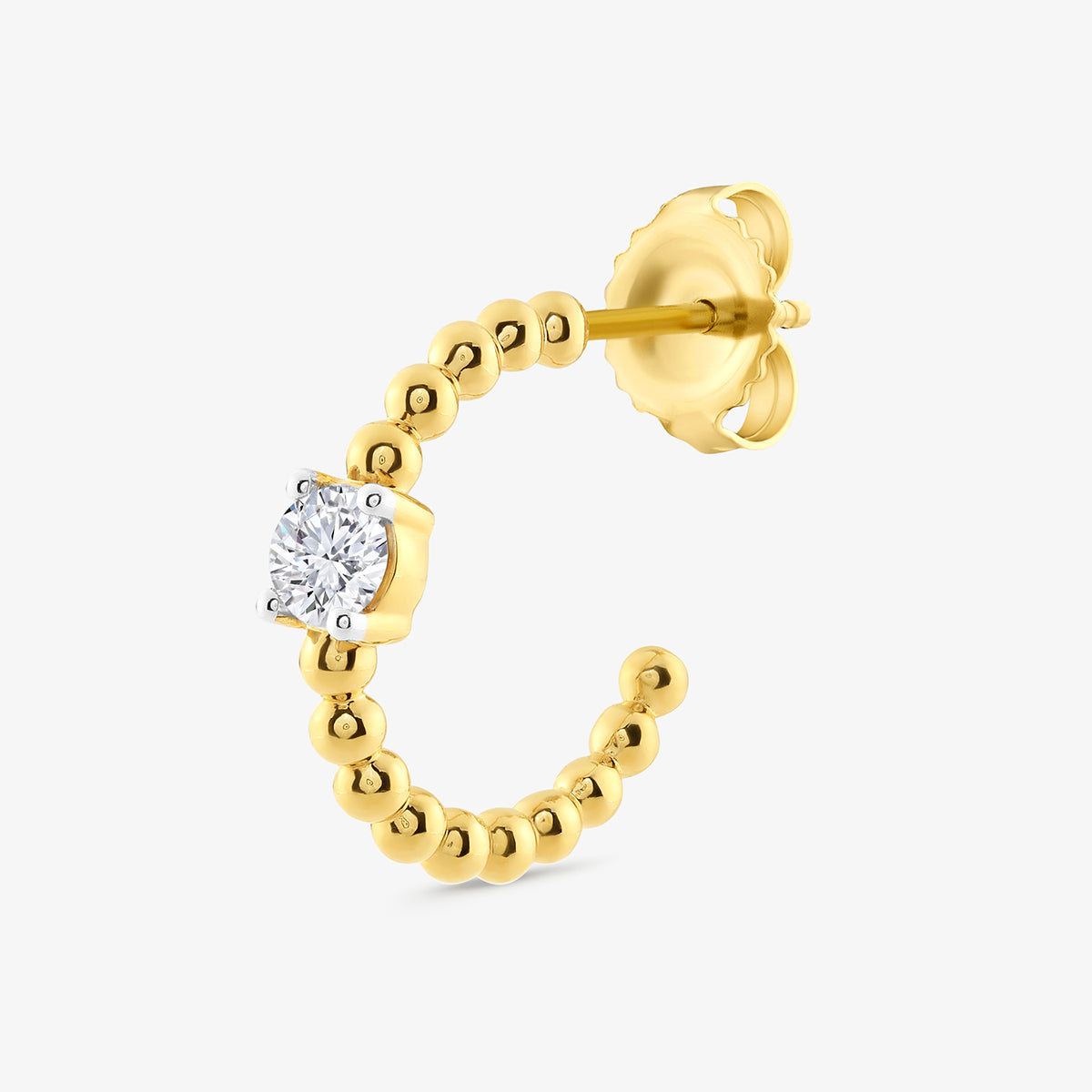 Side view of round hoop earrings: gold-tone vermeil with bezel-set cubic zirconia