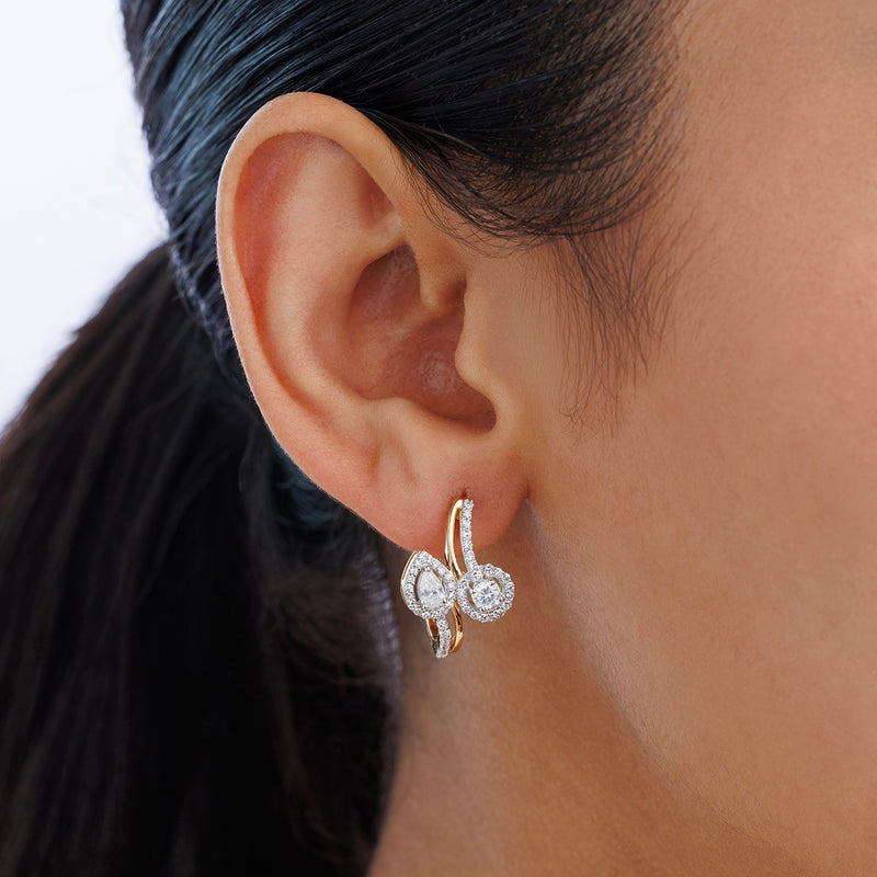 Close-up of a woman's ear wearing TEARDROP Spark Hoop EARRINGS by Keemti Jewels.