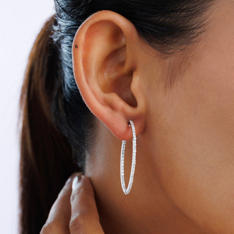 Everyday Glow hoop earrings on ear, thin oval pavé hoops, silver vermeil