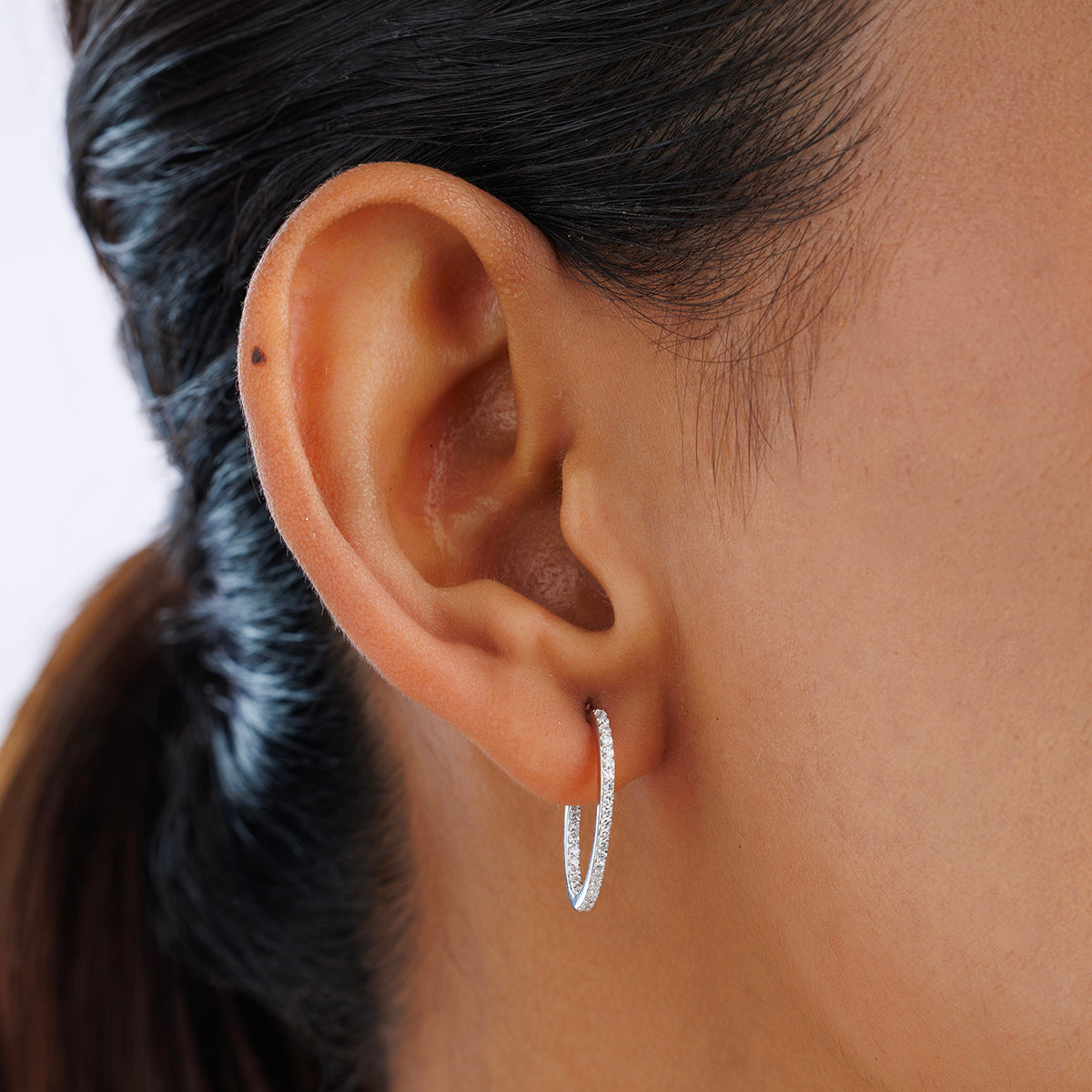 Silver 925 vermeil line hoop earrings on ear, slim pavé hoop with stud backing