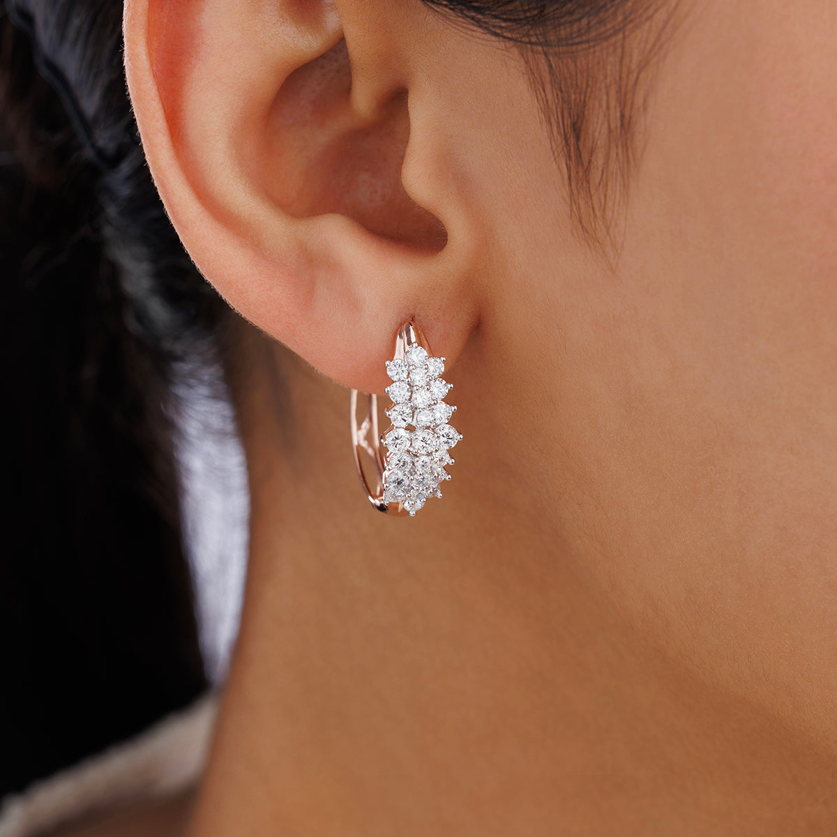Close-up of Keemti Jewels' AURORA Grid Huggie Earrings featuring multiple sparkling white gemstones.