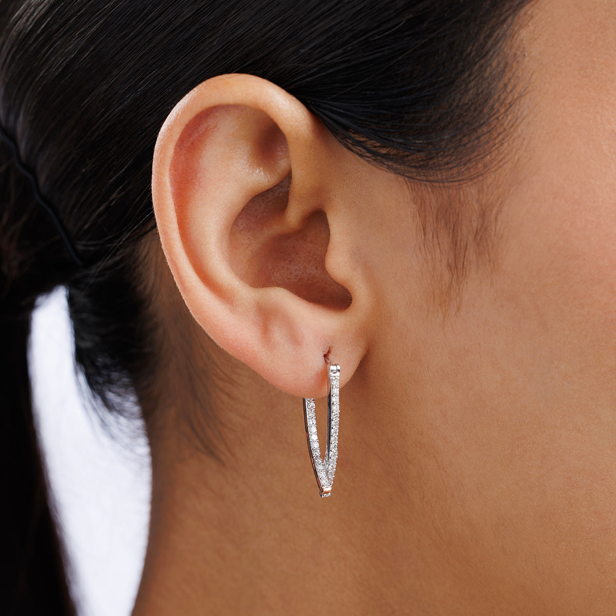 CRISS Sparkle hoop earrings worn: slim silver-tone hoop with pavé stones