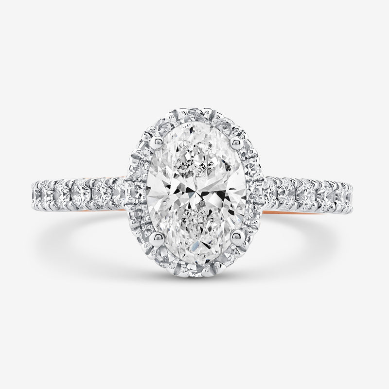 The CLASSIC Oval Mount Solitaire RING by Keemti Jewels features a diamond halo and studded band on a white background.