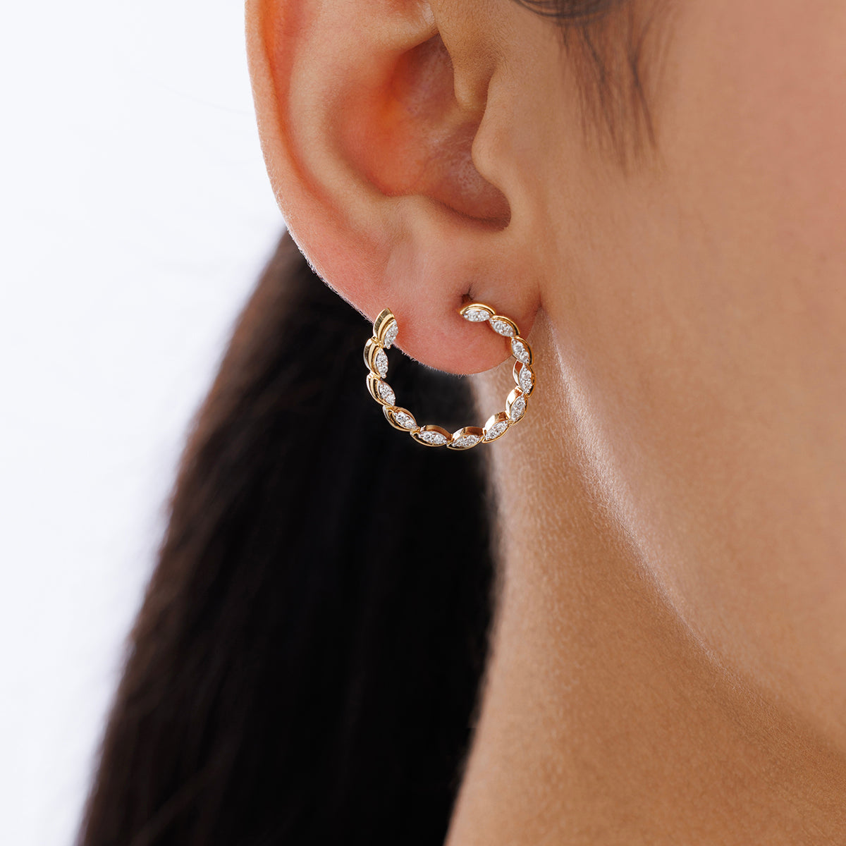 Spark Hoop earrings worn: gold-tone hoop with oval sparkle stones on ear