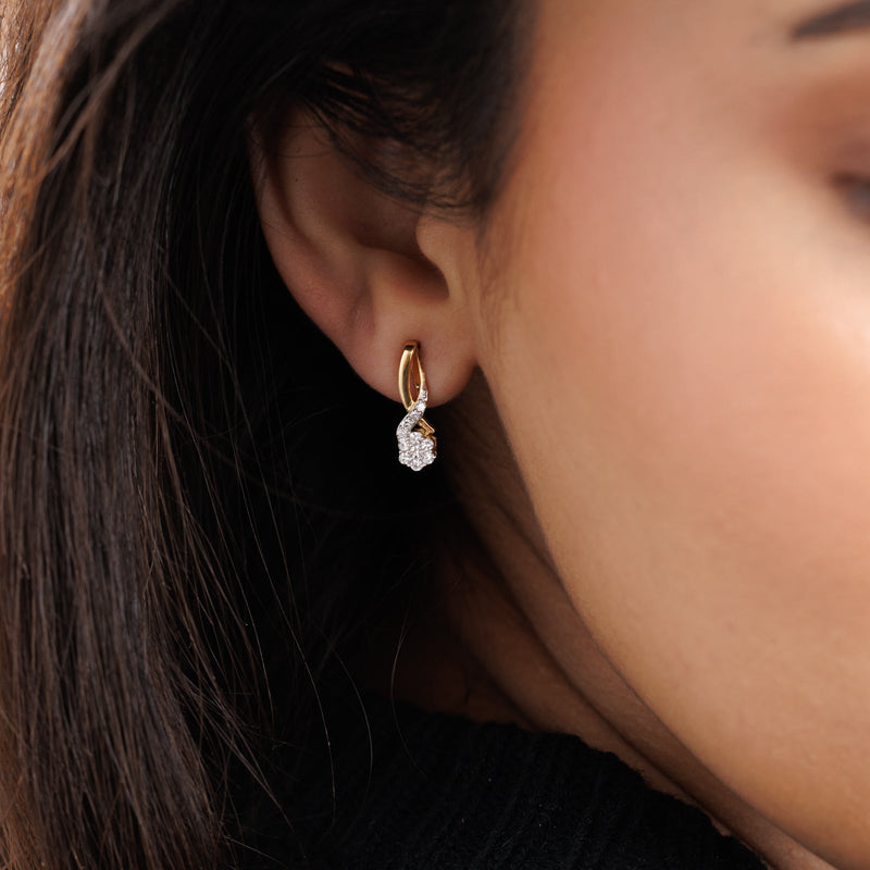 Twisted knot drop earrings on ear, gold vermeil with round pavé stone cluster