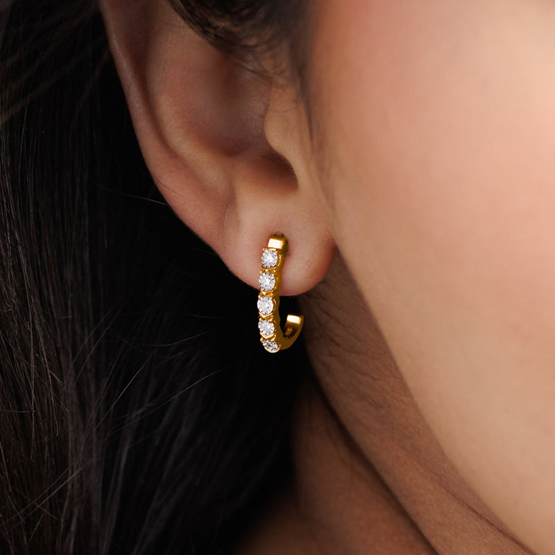 Close-up of a woman's ear in Keemti Jewels Eternal Bloom Pink Hoop Earrings—small hoops with sparkling stones.