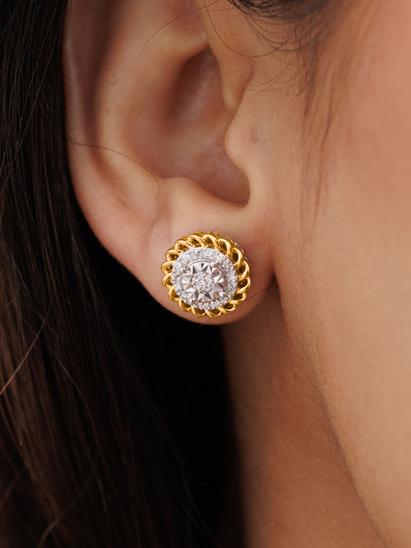 Close-up of an ear wearing Keemti Jewels' Aurora Cluster Stud Earrings with gold, diamonds, and pink-plated accents.