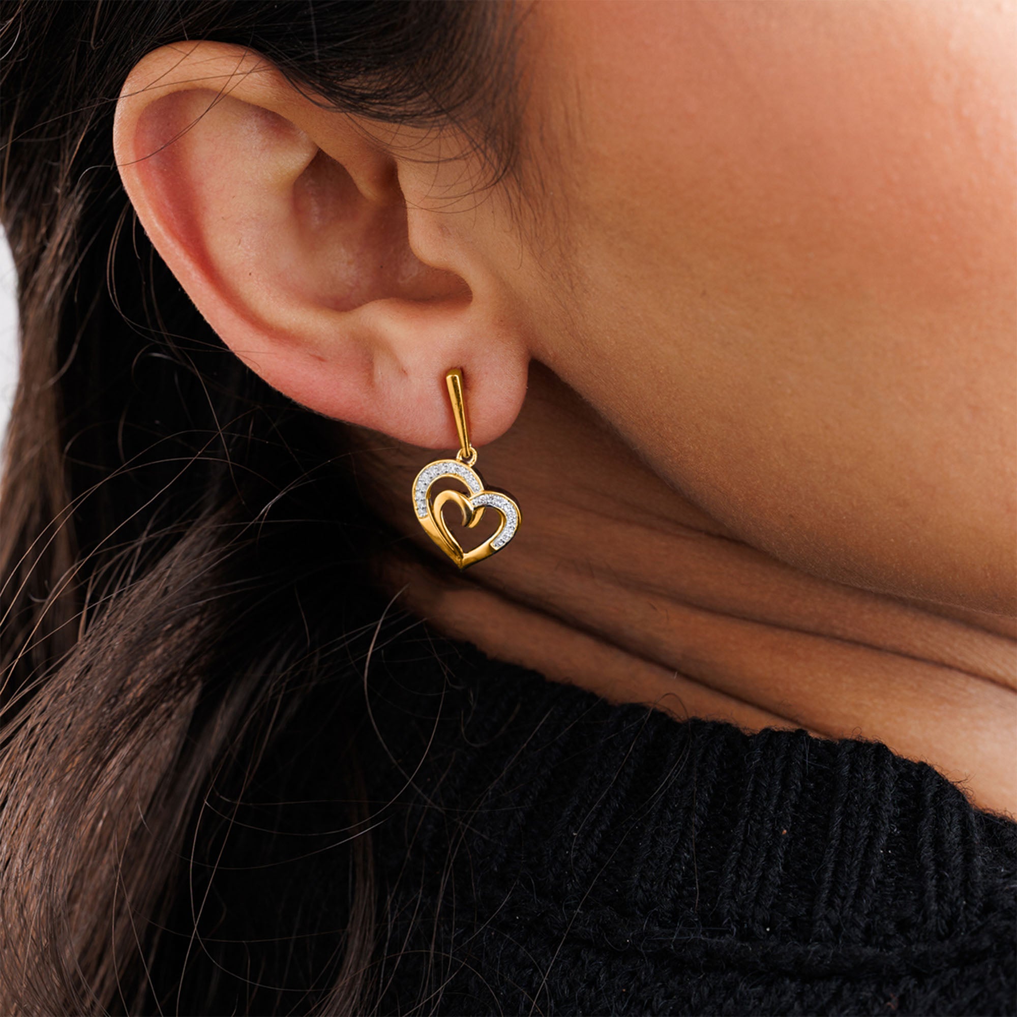 Linked In Love Heart Earrings by Keemti Jewels: gold hearts with diamond accents, worn for a symbol of unity and love.