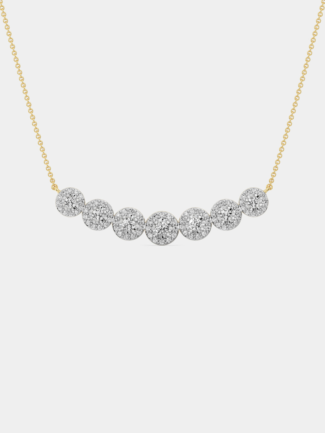 Keemti Jewels' Symphony Of Sparkle Necklet: seven diamond clusters in a gold bar design, shown on white.