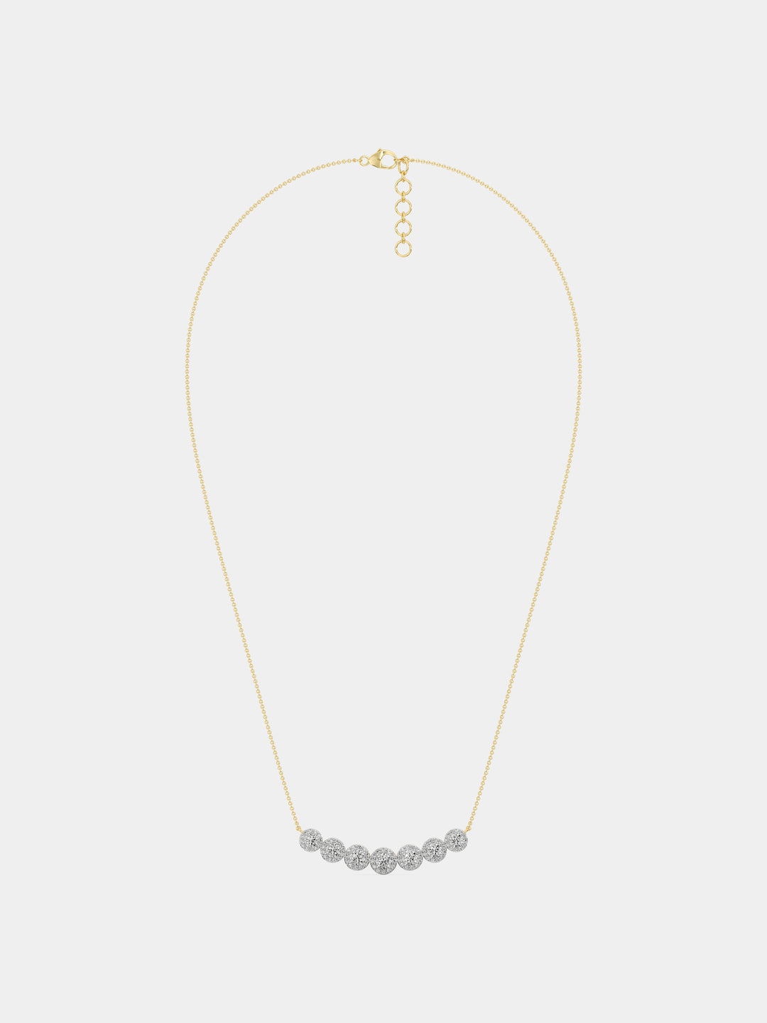 Symphony Of Sparkle Necklet by Keemti Jewels: seven round diamonds elegantly set in a gold bar on white.