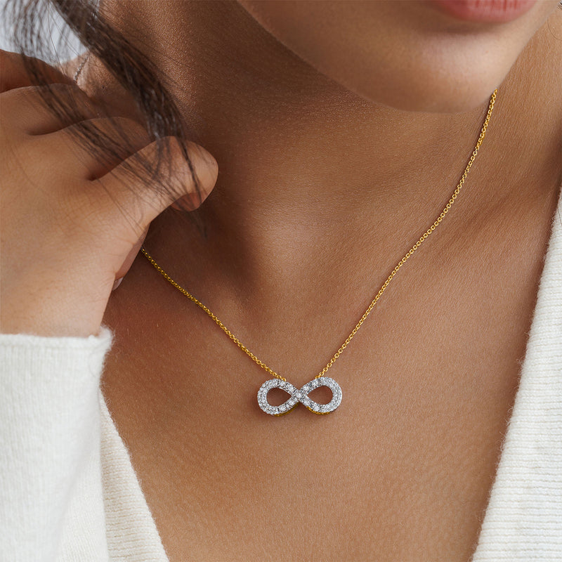 A woman in a white top wears the Keemti Jewels Classic Infinity Diamond Necklet, symbolizing eternal love.