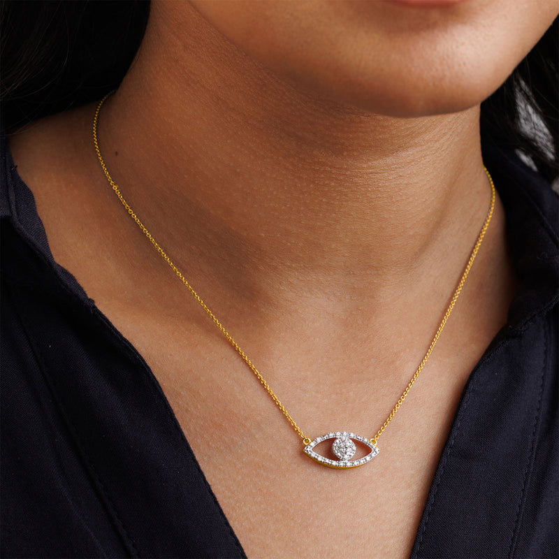 Keemti Jewels' Halo Evil Eye Necklet: a diamond-halo pendant for chic protection, stunning over any dark top.