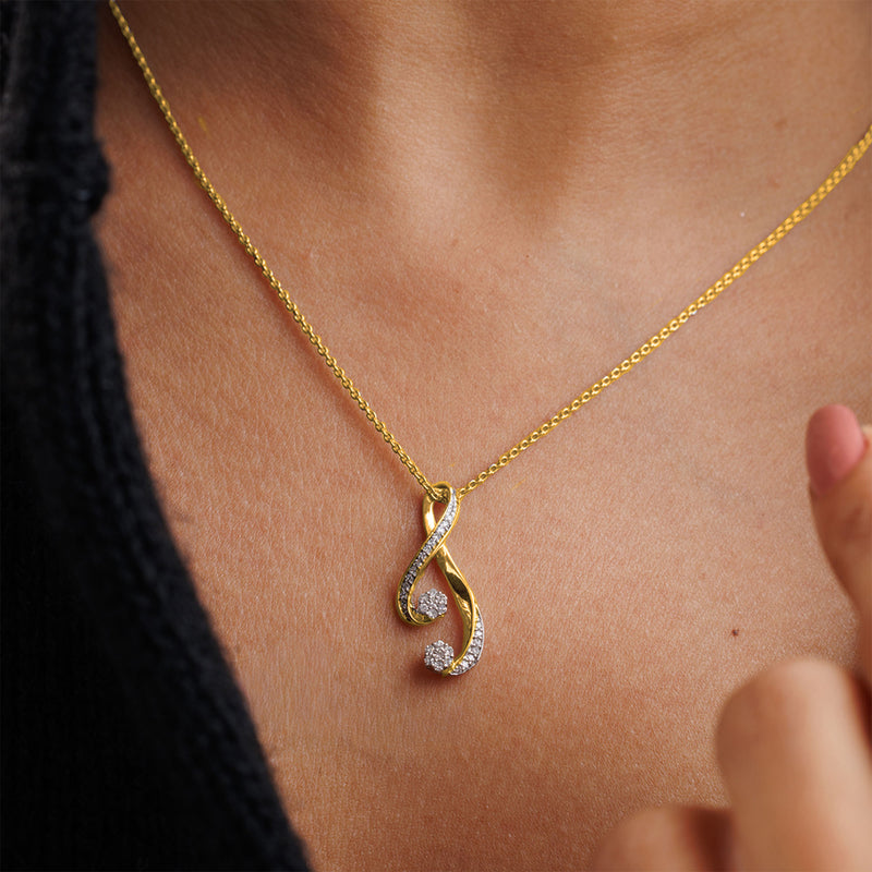 Keemti Jewels' Infinity Twist Chain Necklet with a curved pendant shines elegantly on black clothing at the neck.