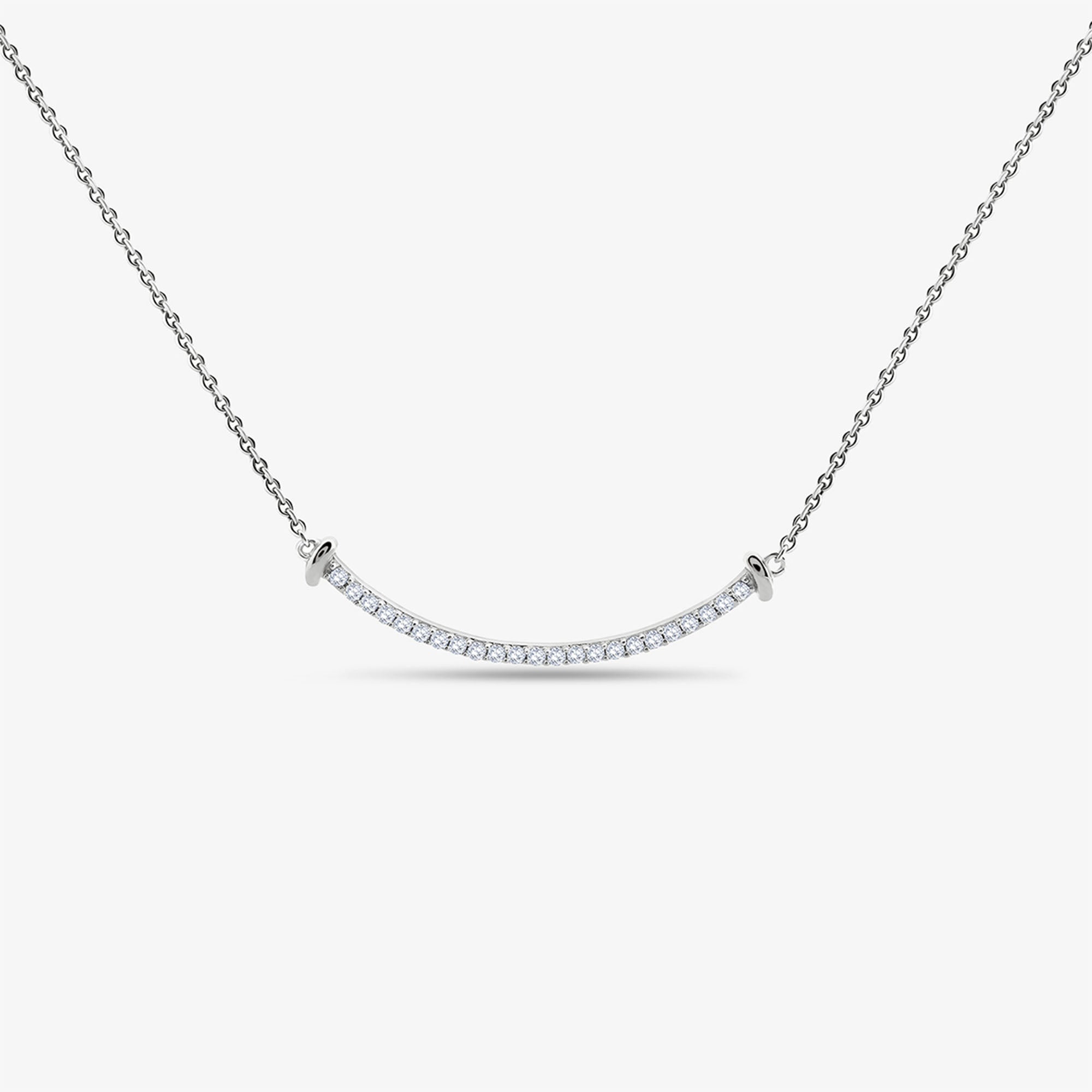 The Aurelia Arc Necklet by Keemti Jewels dazzles with a silver dual-tone bar and shimmering diamond accents.