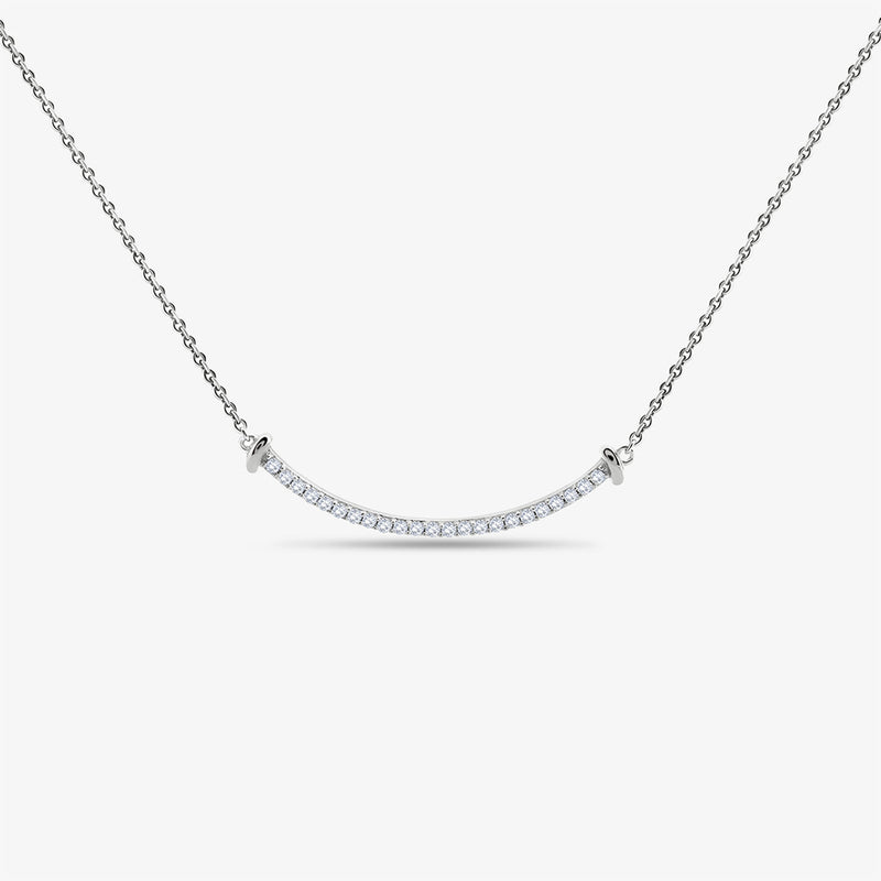 The Aurelia Arc Necklet by Keemti Jewels dazzles with a silver dual-tone bar and shimmering diamond accents.