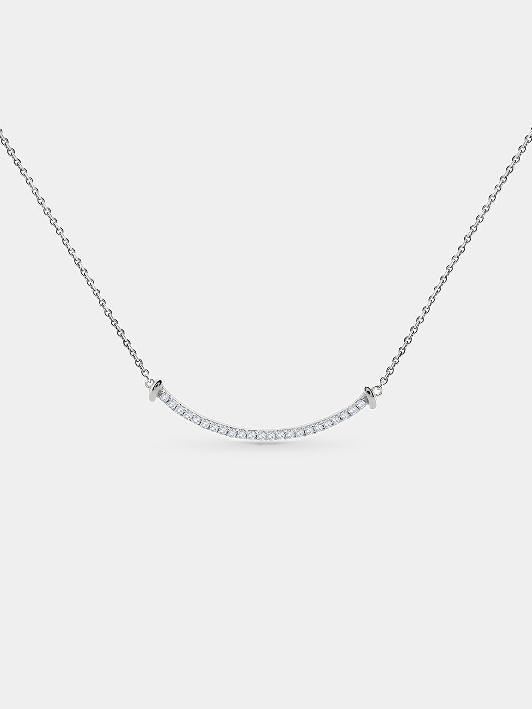 The Aurelia Arc Necklet by Keemti Jewels dazzles with a silver dual-tone bar and shimmering diamond accents.