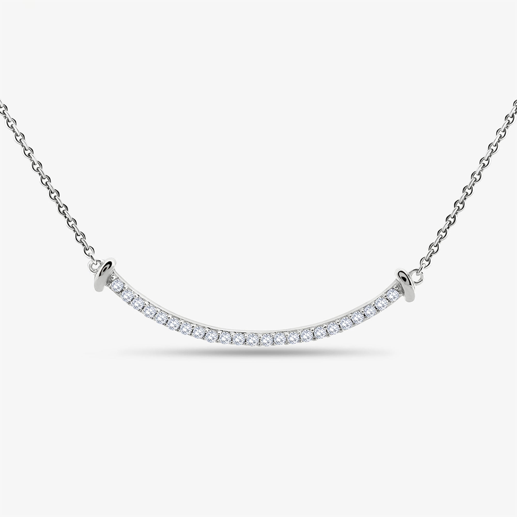 The Aurelia Arc Necklet by Keemti Jewels features a curved silver bar with diamond accents for modern sophistication.