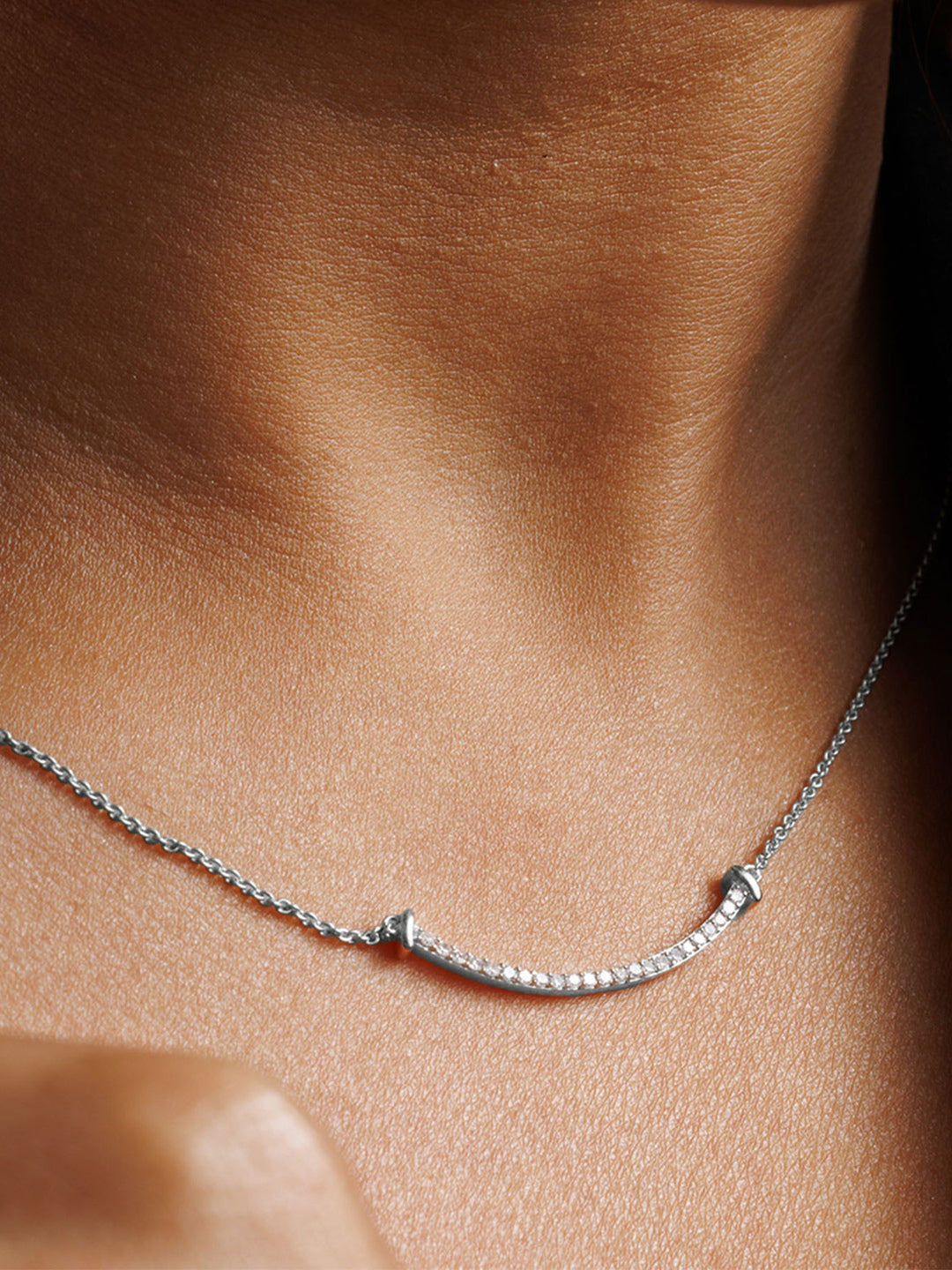 Aurelia Arc Necklet by Keemti Jewels: a curved bar pendant with diamond accents for modern sophistication.