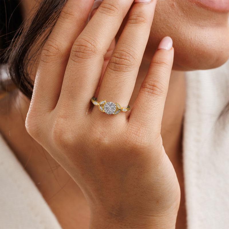 A woman’s hand in the Iris Sparkle Cluster Ring by Keemti Jewels—vintage gold with dazzling diamonds near her face.