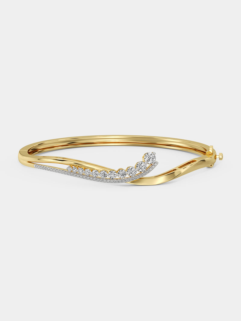 Close-up of a person wearing the Keemti Jewels Crescent Spark Oval Bracelet, a luxury gold piece with sparkling gems.