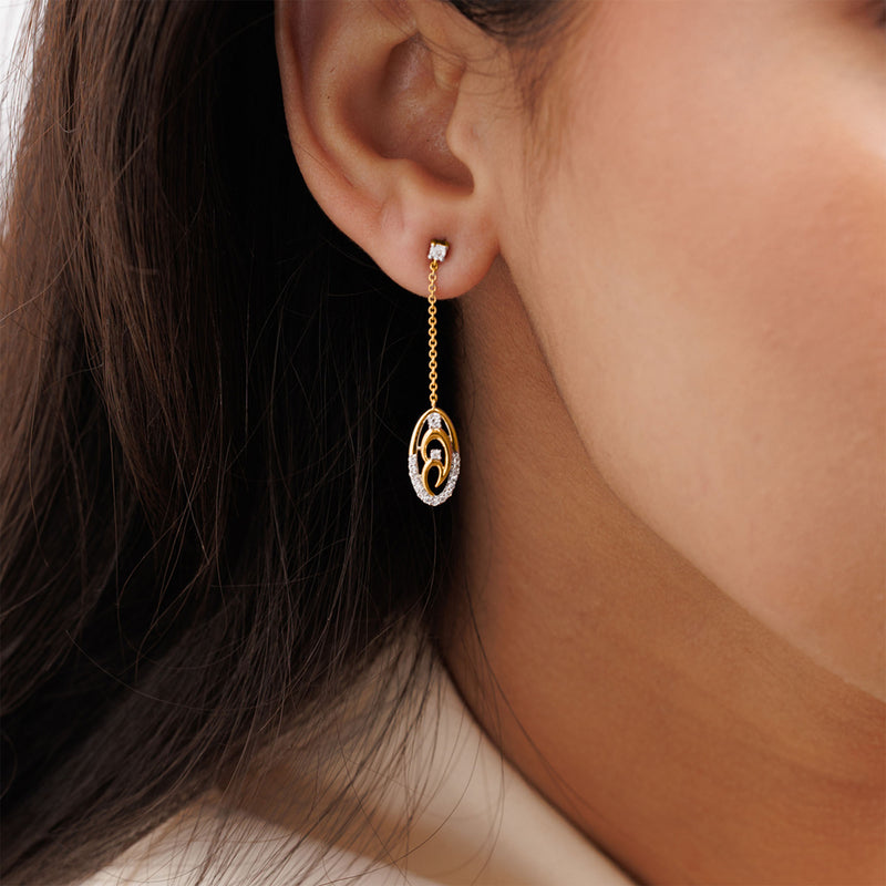 Close-up of a woman's ear wearing Keemti Jewels' Two-Tone Chain Drop Earrings in a minimalist, circular design.