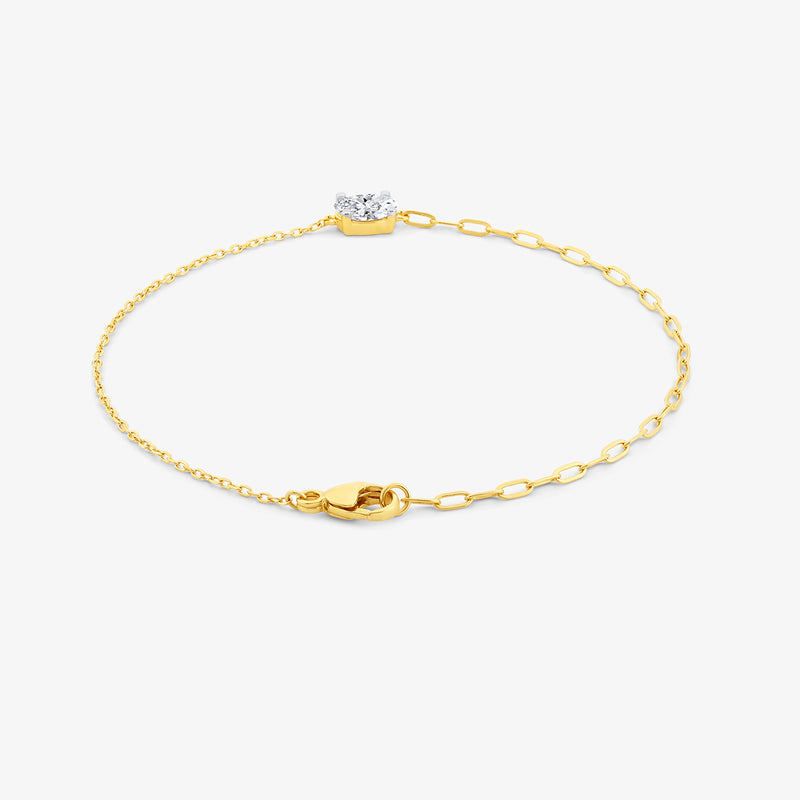 Keemti Jewels Minimal Oval Diamond Chain Bracelet: fine link, single diamond, lobster clasp on white background.