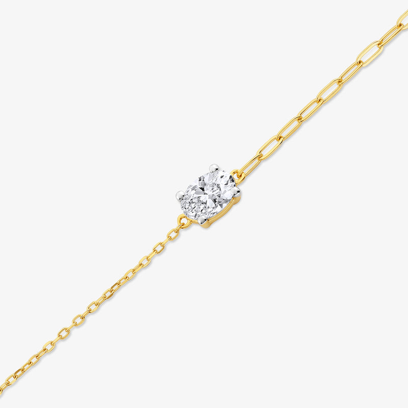 Keemti Jewels’ Minimal Oval Diamond Chain Bracelet features a sparkling oval diamond on a fine link chain.